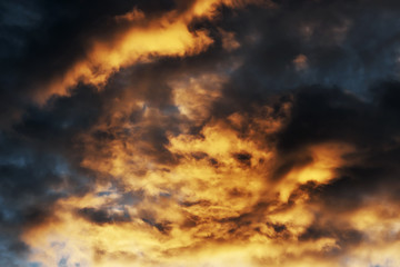 dramatic blue sky  with red and black clouds