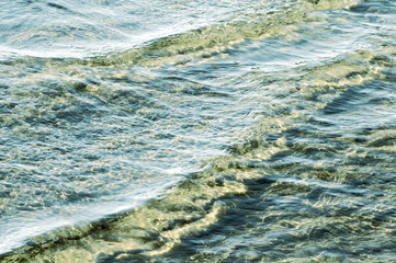 water ripples  on the shore beach