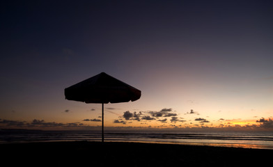 beautiful sunset on the beach with parasol © krungchingpixs