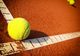 Tennis balls on a tennis clay court - 88958334