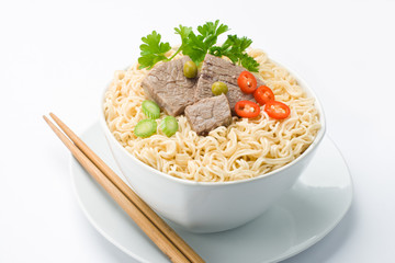 Noodles in bowl and chopsticks