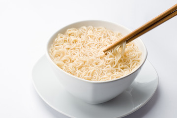 Noodles in bowl and chopsticks