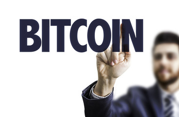Business man pointing the text: Bitcoin