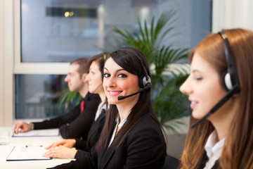 Smiling customer representatives at work