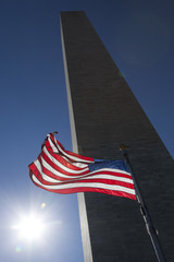 Naklejka premium USA flag dark sky and Washington Monument