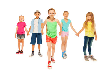 Five kids with happy little girl pull her friends 