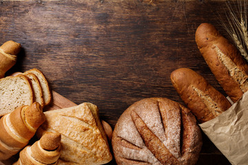 Different bread on a rustic dark background 