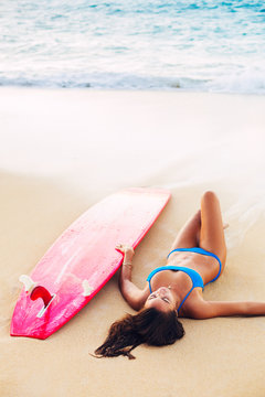 Beautiful Surfer Girl Relaxing on the Beach