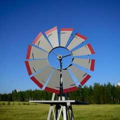 Decorative Windmill in Farm Field
