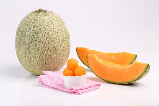 Organic cantaloupe melon isolated on white background
