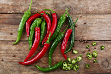 Hot peppers on wooden table close up