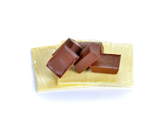 cheese slices and chocolate bar on white background