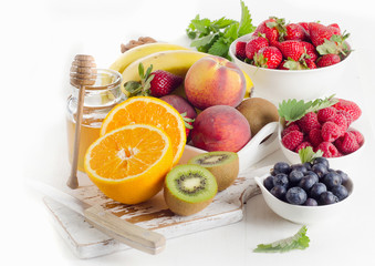Fototapeta na wymiar Fresh fruits, honey and berries.