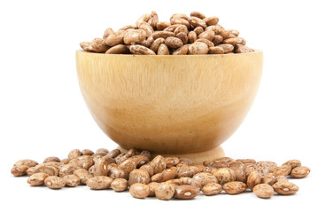 pinto beans on wood cup isolated