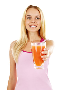 Young beautiful woman with glass of fresh grapefruit juice, isolated on white