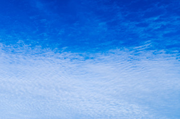 Clouds spreading in blue sky, texture background