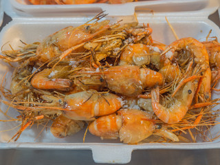 Fresh Grilled Shrimp Baked salt Placed in a foam box for sale in the market.Delicious Seafood.