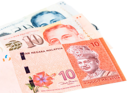 Close up of Singapore Dollar currency note against Malaysia Ringgit