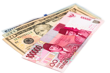 Close up of Indonesia Rupiah currency note against US Dollar