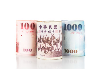 Close up of rolled up New Taiwan Dollar currency note