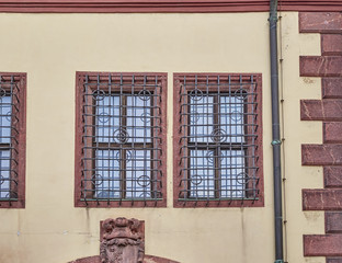 vintage windows secured with metal bars