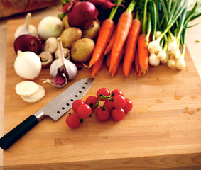 Fresh organic vegetables on a table with a knife for cooking