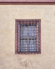 Fototapeta na wymiar vintage window secured with metal bars