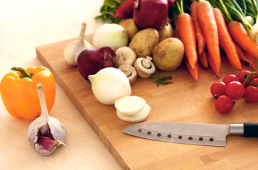 Fresh organic vegetables on a table with a knife for cooking