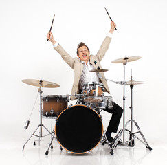 young man  on drums expresses joy 