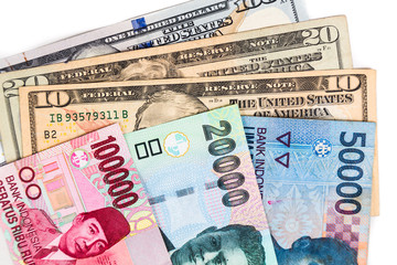 Fototapeta na wymiar Close up of Indonesia Rupiah currency note against US Dollar