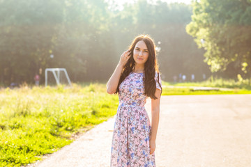 beautiful young brunette woman  on the  park 