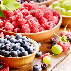 Wooden bowls with organic berries
