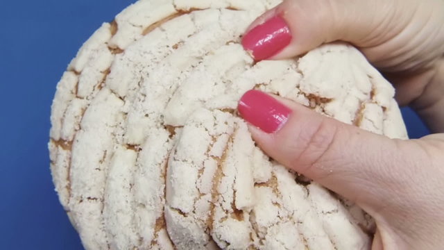 Pulling White Sweet Bun Bread apart Slow Motion 120fps.