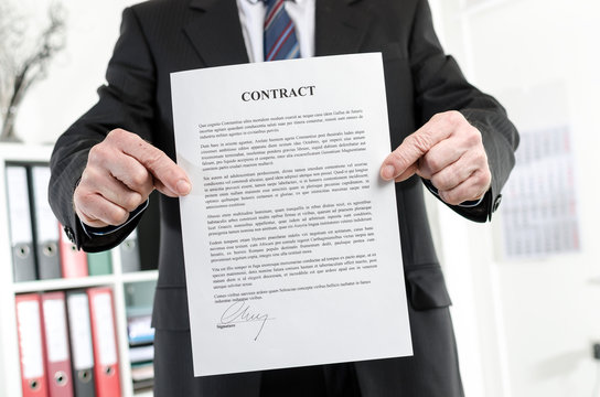 Businessman holding a contract