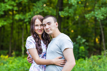 Fototapeta premium Smiling Couple Relaxing in a Park. 