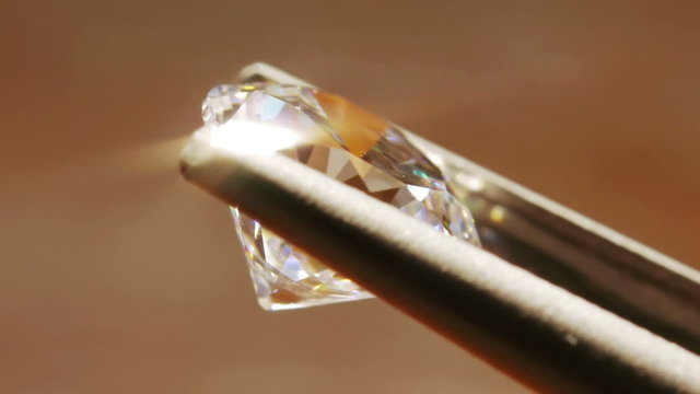Diamond Seen Close Up With Pincers