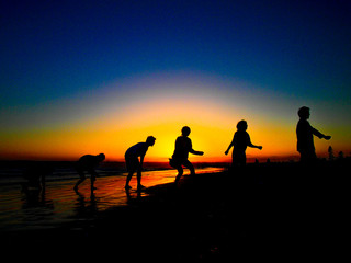 Fototapeta na wymiar The Sun Set And Silhouette of Human Evolution at the Coronado Be
