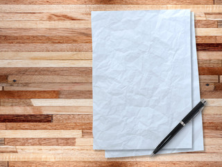 white paper sheet on wooden table