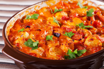 Casserole with chicken, potatos and tomatos