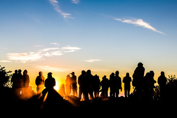 Fototapeta na wymiar People enjoys the sunrise on the top of Merbabu volcano in Indon