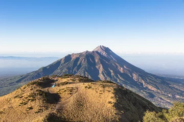 Tuinposter A view of Merapi volcano in Java in Indonesia © jakartatravel