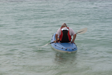 Fototapeta na wymiar Canoeing on the tropical sea at summer