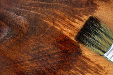 Staining wooden surface. Home decorating concept. DIY