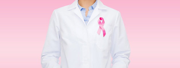 close up of doctor with cancer awareness ribbon
