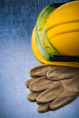 Composition of construction leather gloves building helmet and t