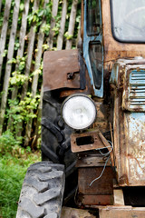 Fototapeta na wymiar Headlight close-up of an old tractor