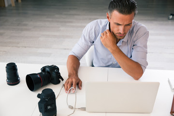 Photographer using laptop