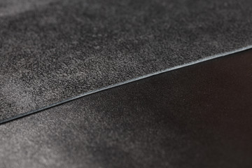 Fototapeta premium Two pieces of black leather