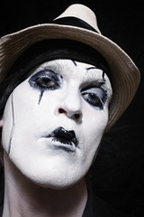 Portrait of a theatrical actor with dark makeup