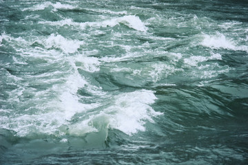 Fototapeta na wymiar River water with turbulent flow